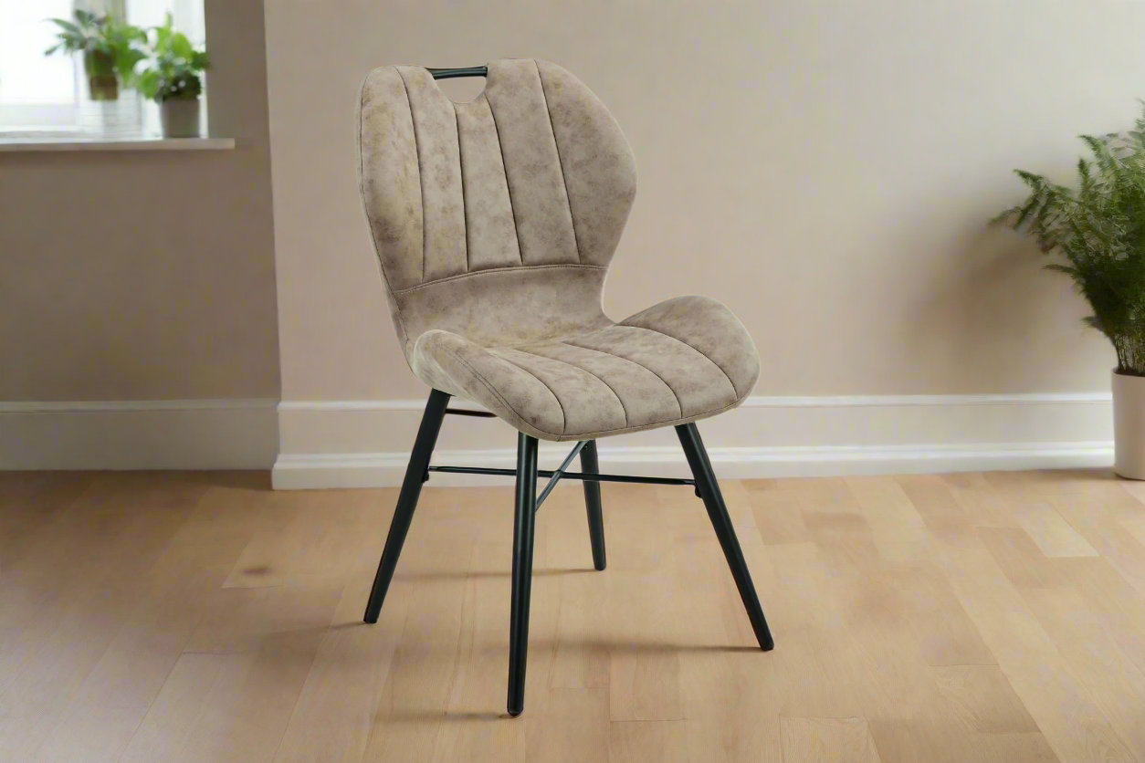 Beige upholstered chair with black metal legs on a white background